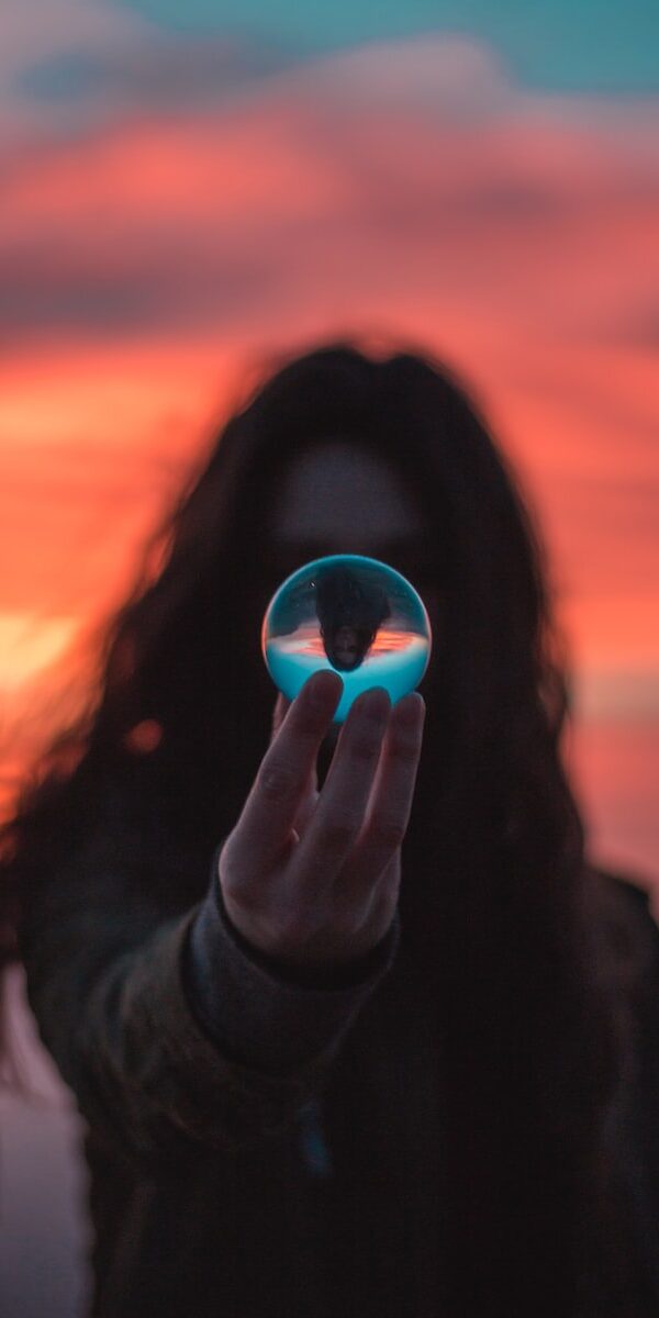 selective focus photography of woman holding ball