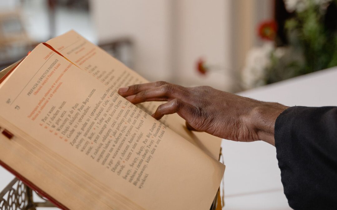 close up view of a person touching a bible