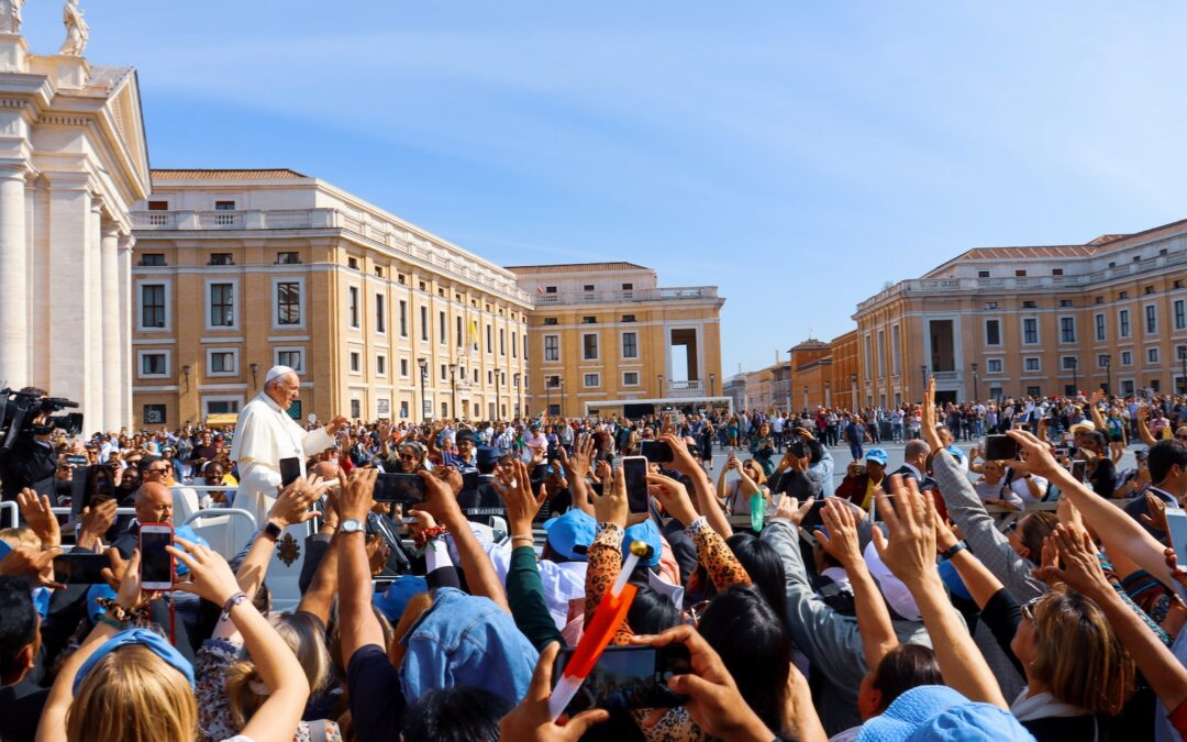 crowd of people gathered in front of a cathedral
